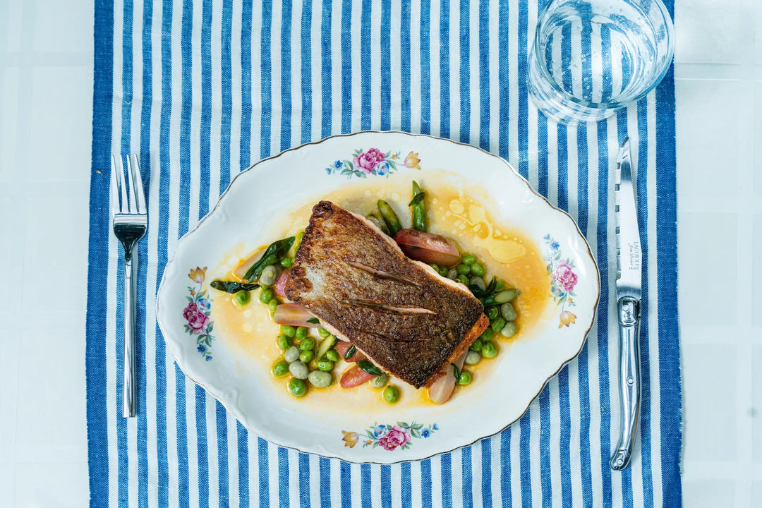 Crispy skin wild salmon, braised radishes, fava beans & English peas
