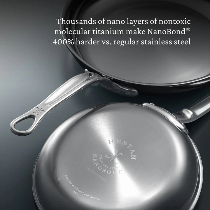 Two NanoBond® frying pans from the Titanium x Tyler Florence Cookware Set (41-piece) are shown, one with the cooking surface visible and the other displaying its base. Text highlights that these pans feature nontoxic molecular titanium, making them 400% harder than ordinary stainless steel.