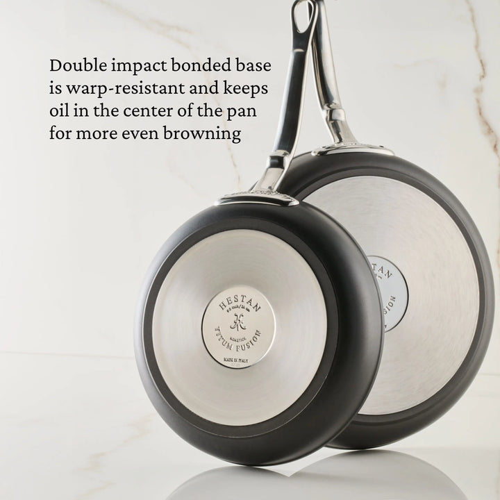 The 11-Inch TITUM® Fusion Nonstick Skillet with Lid is shown from the base, featuring double impact bonded construction for warp resistance and even oil distribution—premium, durable cookware handcrafted in Italy.