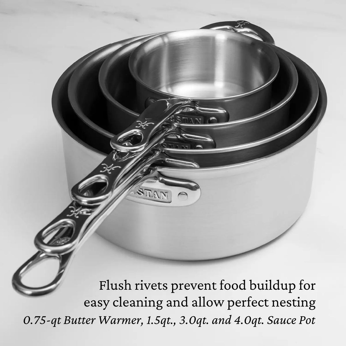 The Thomas Keller Commercial Clad Stainless Steel 0.75-Quart Butter Warmer nests with other tri-ply saucepots. Flush rivets allow easy cleaning; available sizes: 0.75-qt, 1.5-qt, 3.0-qt, and 4.0-qt—chef-designed for versatility.