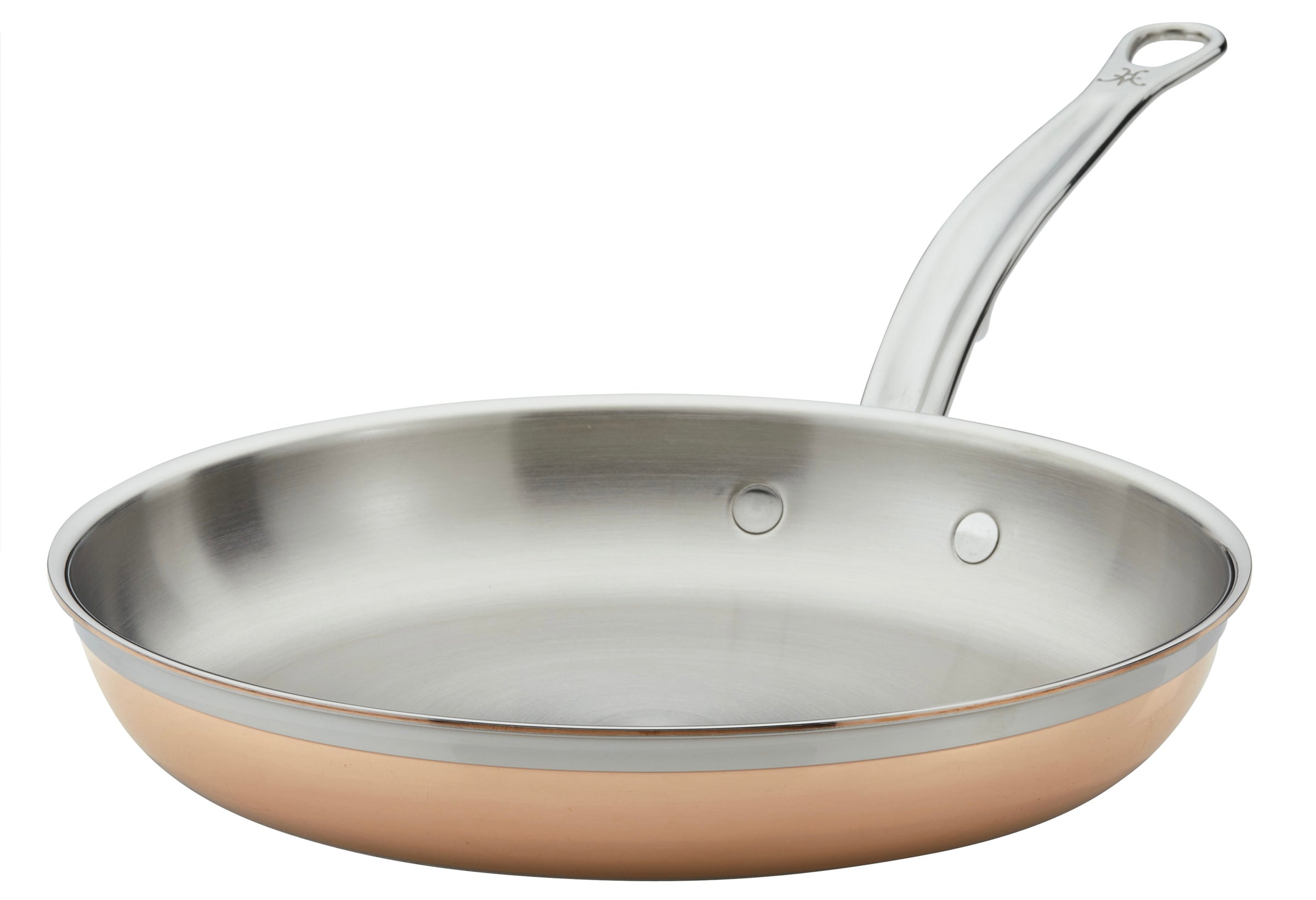 A stainless steel frying pan with a copper bottom is shown. It has a smooth, curved handle attached with two rivets. The interior is shiny and reflective, with a flat cooking surface.