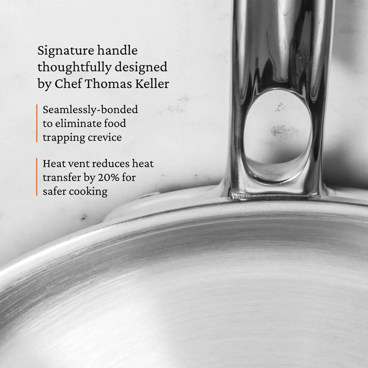 Close-up of the ProBond® Luxe™ Polished Clad Stainless Steel Ultimate Set handle, featuring seamless bonding to prevent food trapping and a heat vent reducing heat transfer by 20%—chef-designed with Italian craftsmanship.