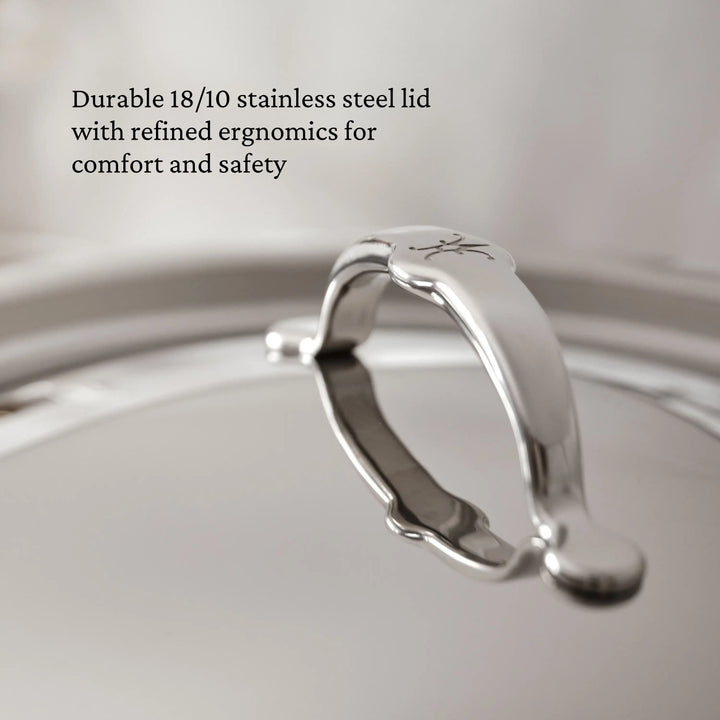 Close-up of the ProBond® Luxe™ Polished Clad Stainless Steel Stockpot lid, featuring a curved handle. Image text: Durable 18/10 stainless steel lid—crafted for comfort, safety, and professional Italian-quality cookware.