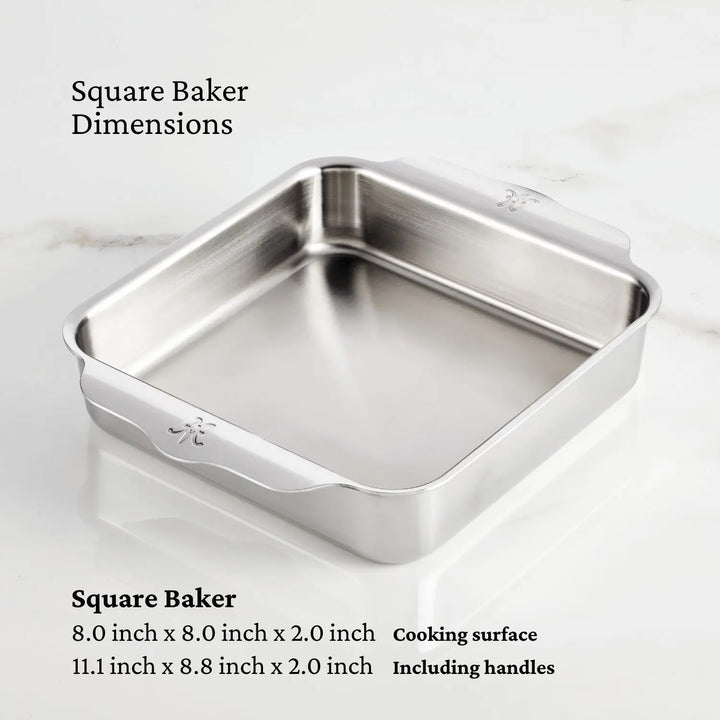 The Hestan OvenBond Tri-ply Square Baker is displayed on a white surface with rounded corners and handles. Cooking surface dimensions: 8 x 8 x 2 inches; overall size with handles: 11.1 x 8.8 x 2 inches.