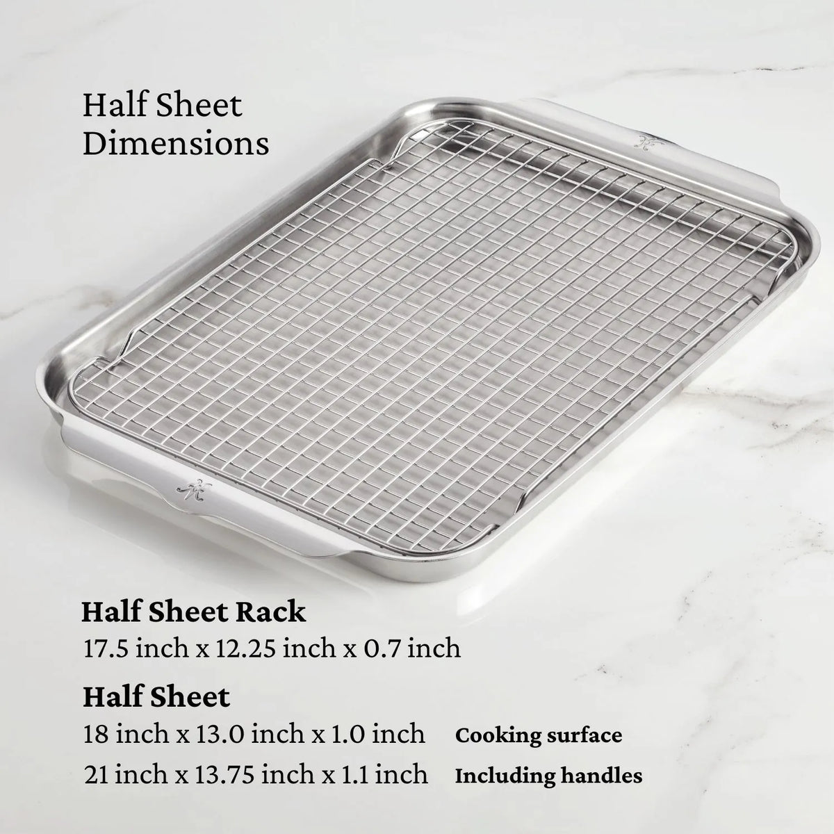 A metal half sheet pan with a wire rack sits on marble, alongside the dimensions in black text, highlighting the Hestan OvenBond Tri-ply 3-Piece Set—durable stainless steel pans ideal for any ovenware collection.