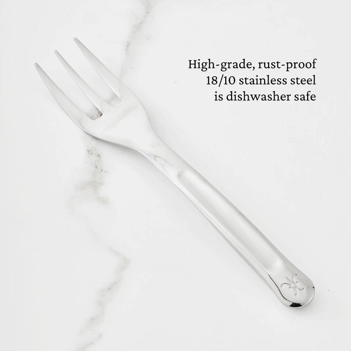 A 10.5-inch Stainless Steel Serving Fork from Hestan Provisions® rests on a white marble surface. Text beside it highlights that the fork is expertly crafted from high-grade, rust-proof 18/10 stainless steel and is dishwasher safe—making it an essential piece among the Hestan Provisions® Serving Tools and a must-have addition to any chef’s collection.