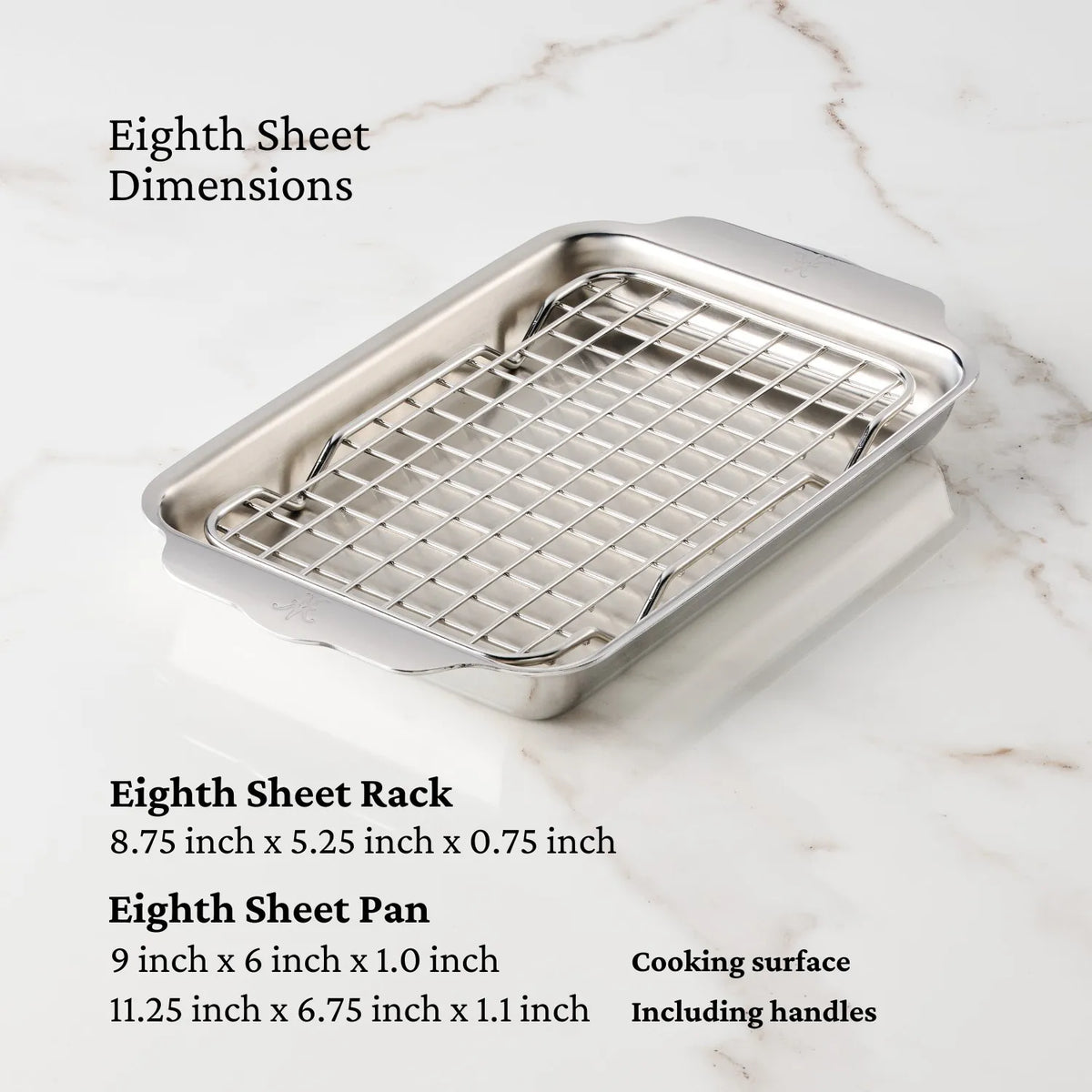 A Hestan OvenBond Tri-ply Mini Eighth Sheet Pan with Rack is displayed on a marble surface, with dimensions highlighting the measurements of the pan, rack, cooking area, and handles.