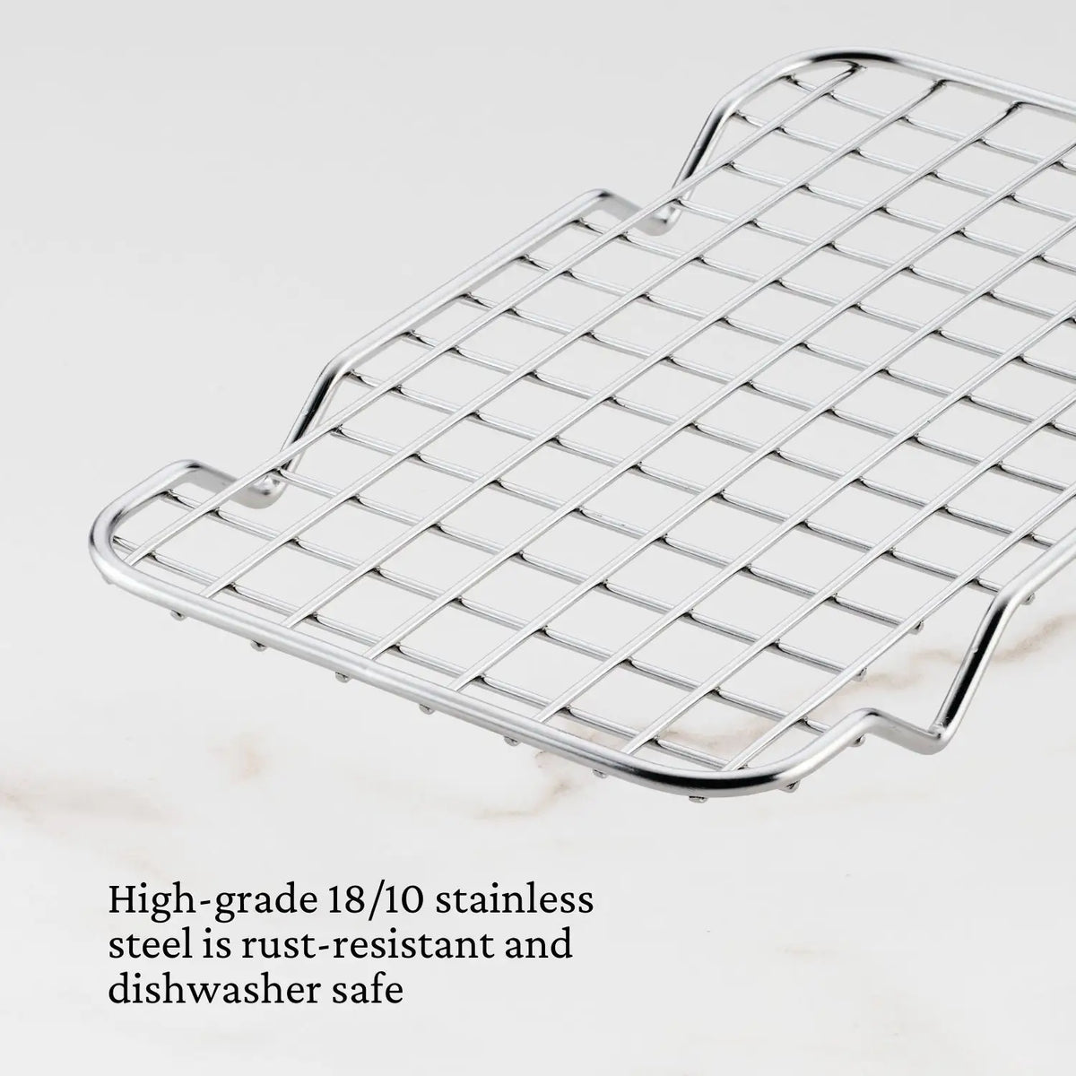 The Hestan OvenBond Tri-ply Mini Eighth Sheet Pan with Rack is shown. Made from high-grade 18/10 stainless steel, it&