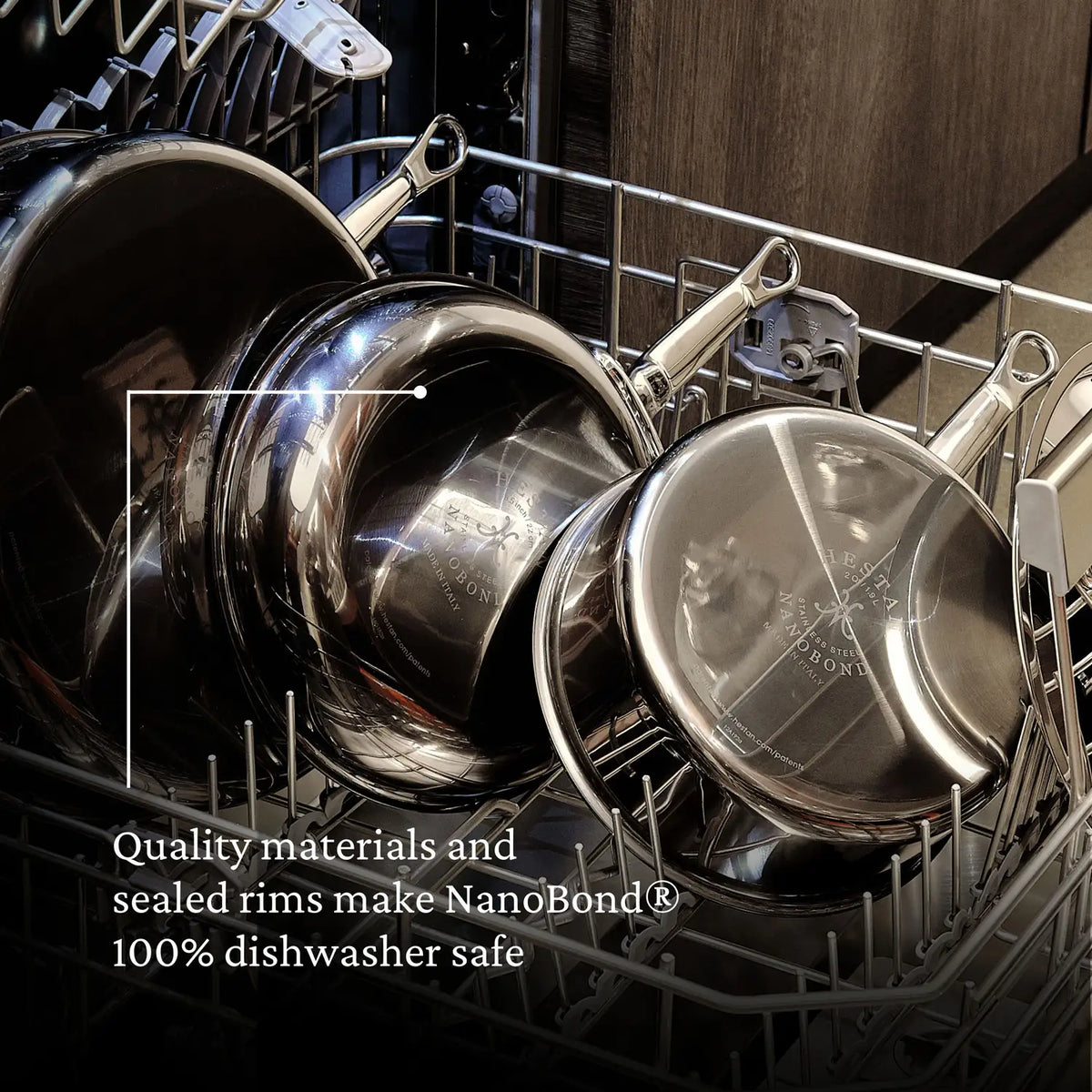 A 14-inch Titanium Wok from NanoBond sits in the dishwasher. The text reads, Quality materials and sealed rims make Hestan NanoBond® 100% dishwasher safe.