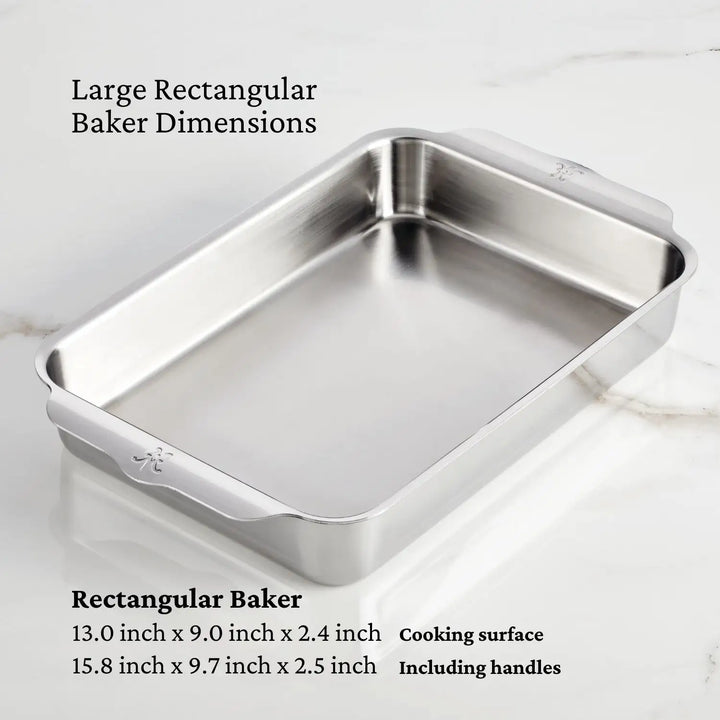 Part of the NanoBond Titanium x Tyler Florence 41-Piece Cookware Set, this rectangular baking pan measures 13.0 x 9.0 x 2.4 in. cooking area (15.8 x 9.7 x 2.5 in. with handles), making it ideal for any kitchen setup.